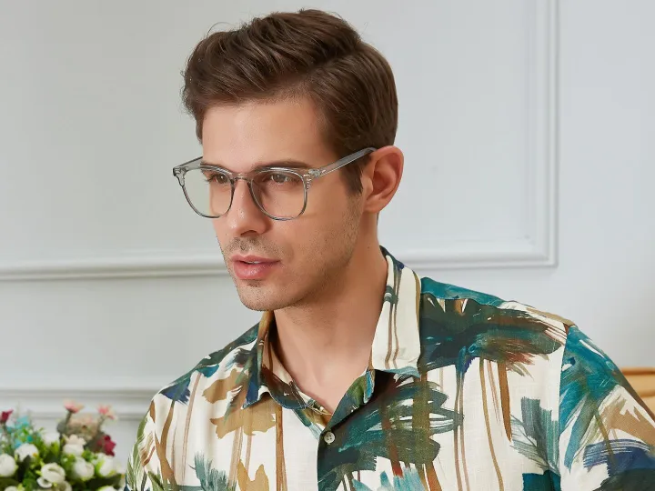 Man in colourful shirt wearing glasses