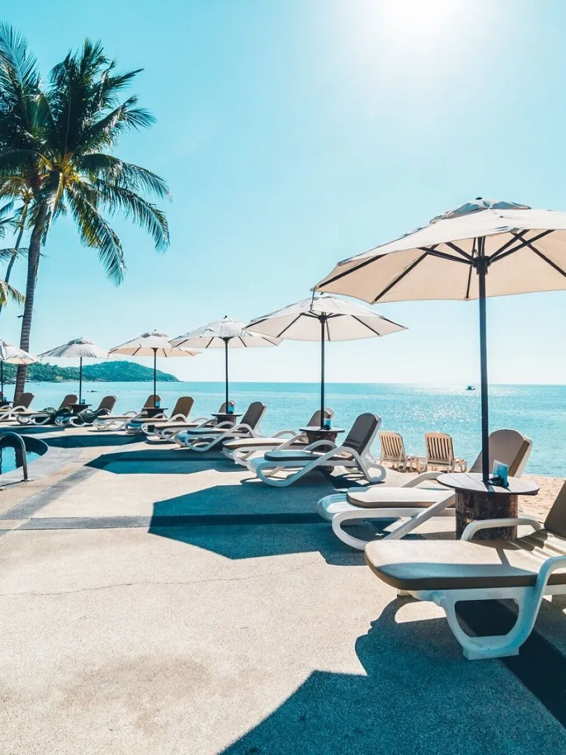 Beautiful tropical beach and sea with umbrella