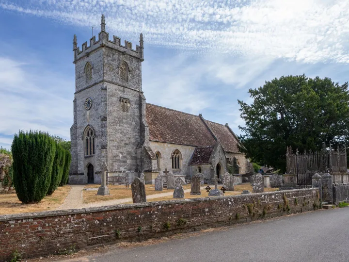 A church and churchyard on a bright morning