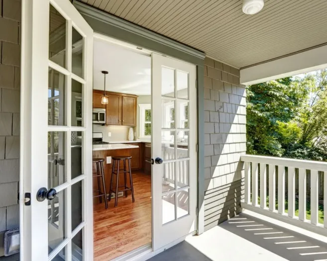 French doors open onto a patio