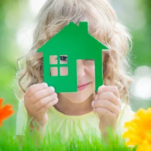 Child with toy house