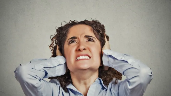 Woman distressed at burglar alarm noise