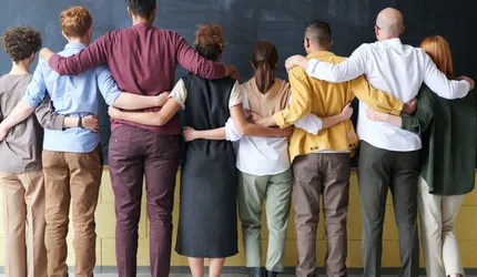 Group of People Standing Indoors