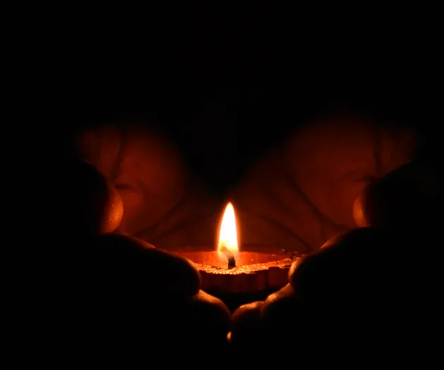 Tealight Candle on Human Palms