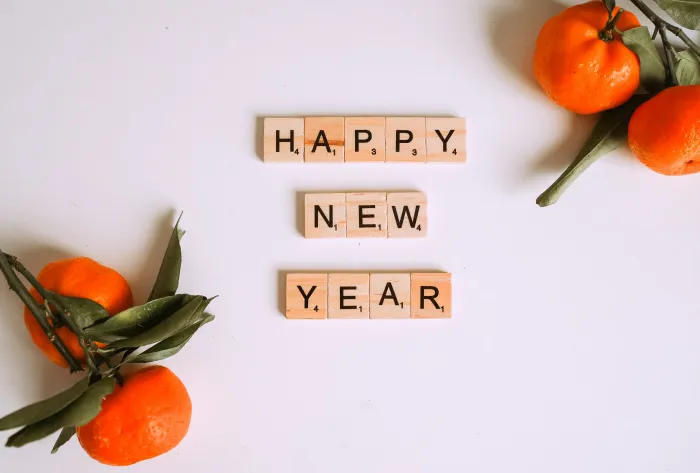 Letter Tiles beside Mandarins