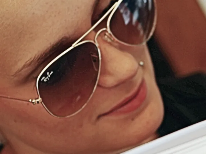 Woman wearing Ray-Ban sunglasses