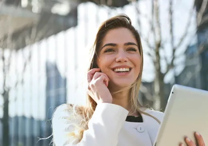 Woman In White Blazer Holding Tablet Computer