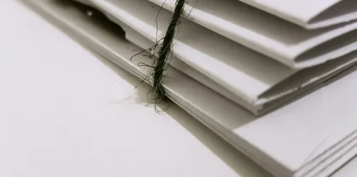 White Paper Folders With Black Tie