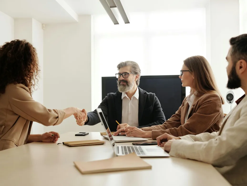 Colleagues in an office celebrating a successful