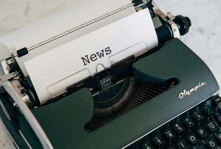 Close-up of an antique typewriter with 'News' on