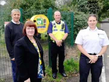 Cllr Paul Moore, Cllr Janet Clowes and representatives of the Police and Fire Services