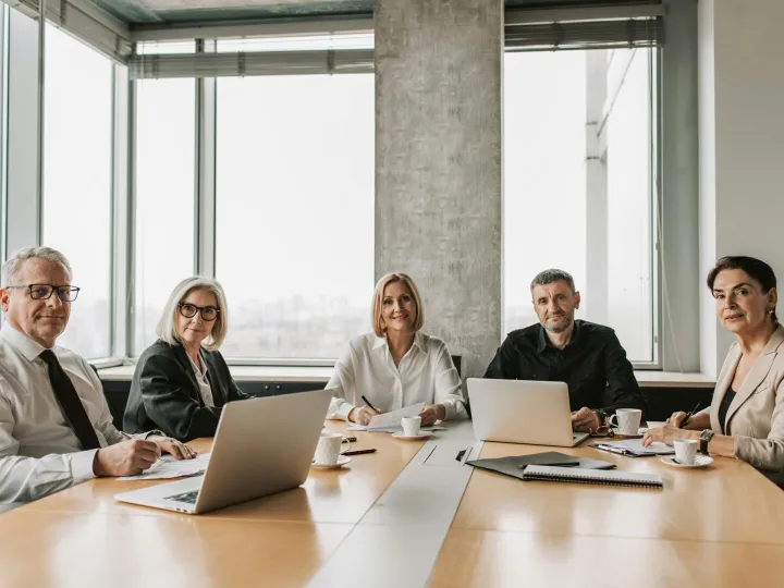 A team of mature business professionals in a meeti