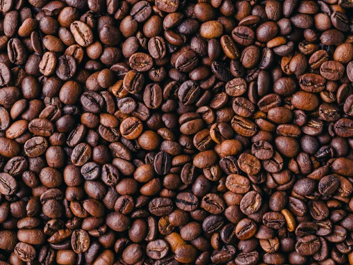 Background of roasted fresh brown coffee beans – perfect for