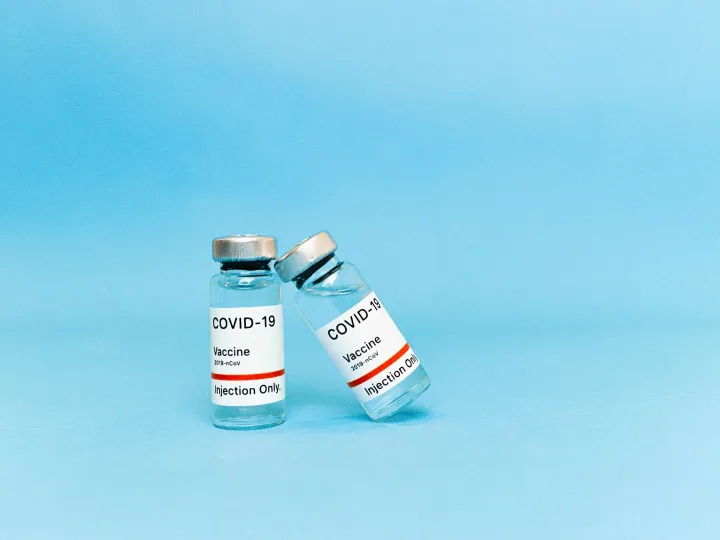 Two COVID-19 vaccine vials labeled for injection