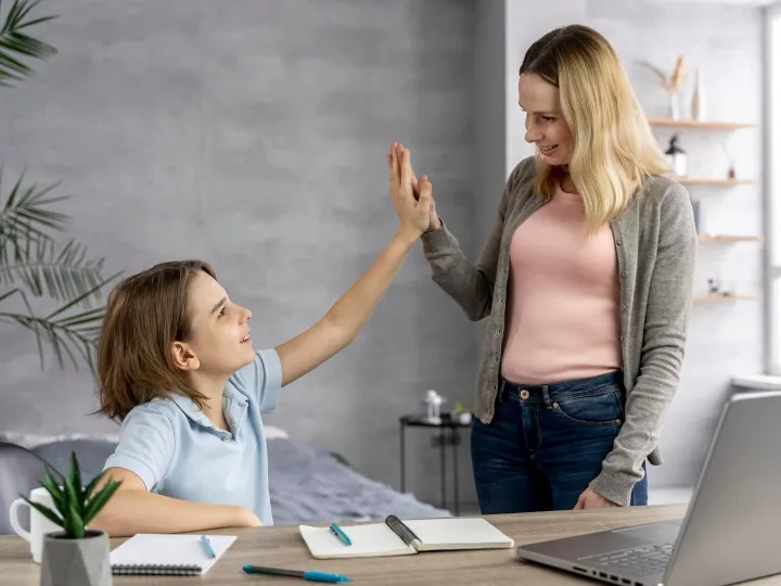 Mother helping daughter to study