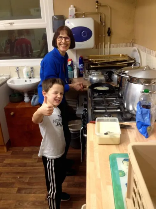 Helen and Lucas making pancakes
