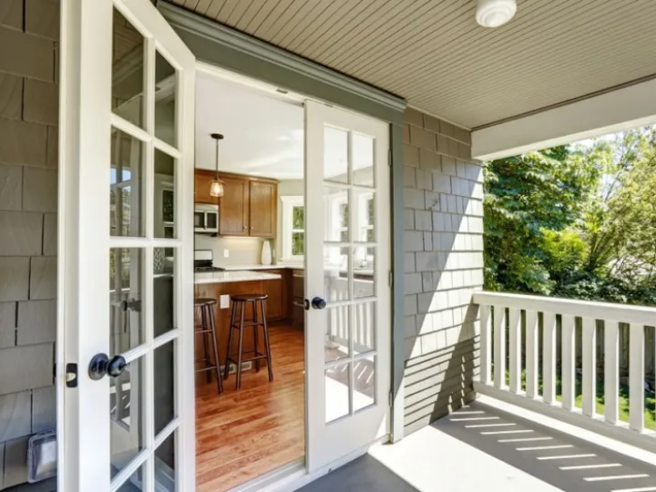 French doors open onto a patio