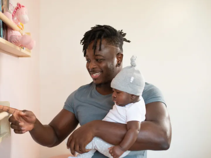 man-carrying-his-baby-3569597