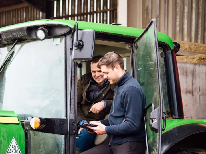 Hugh and Jamie in conversation on tractor