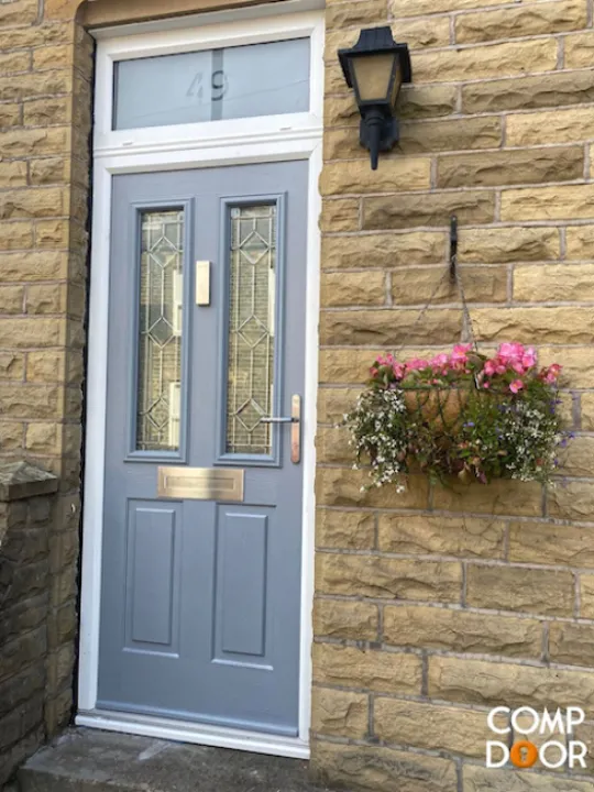 Blue front door with yellow brick