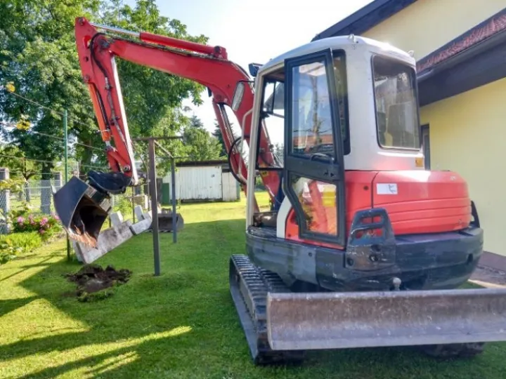 Mini digger in a domestic garden