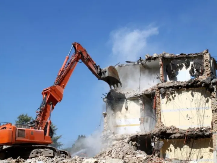 Digger demolishes building in site clearance operation