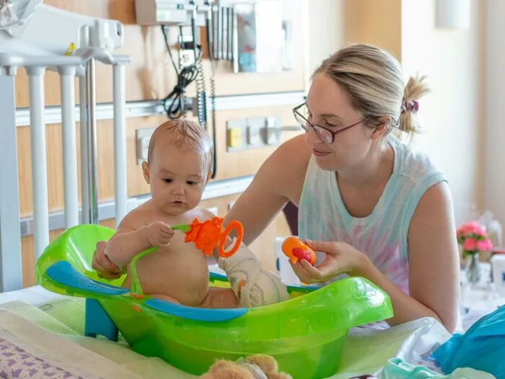Mother Bathing Her Baby