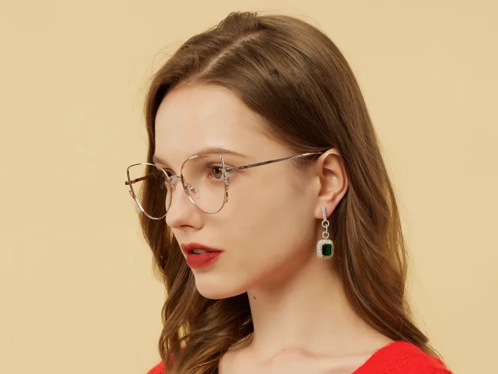 Woman in red wearing metal frame spectacles