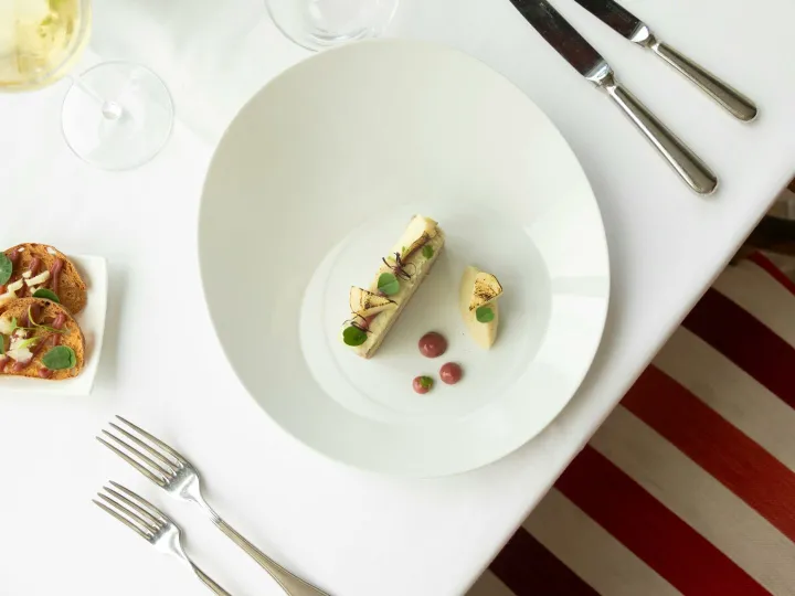 Top view of gourmet French cuisine in a fine dining setup, Vonnas, France.