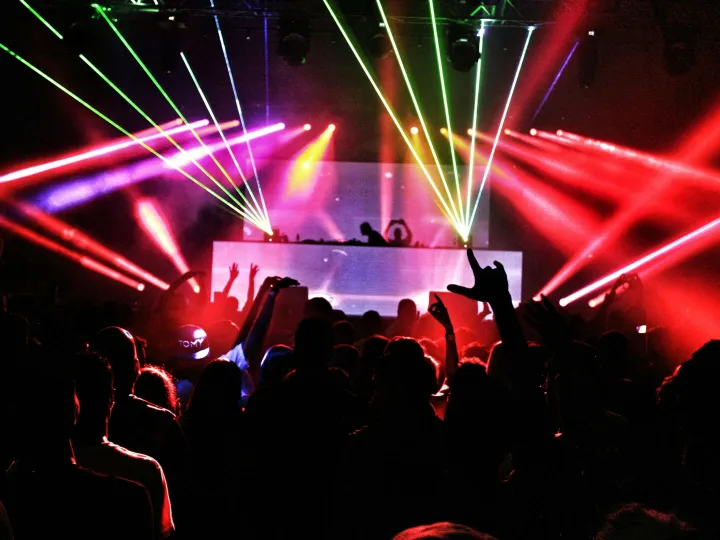 Energetic nightclub scene with laser lights and a