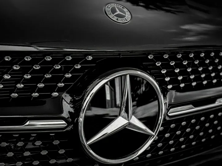 Detailed close-up of a Mercedes-Benz emblem on a