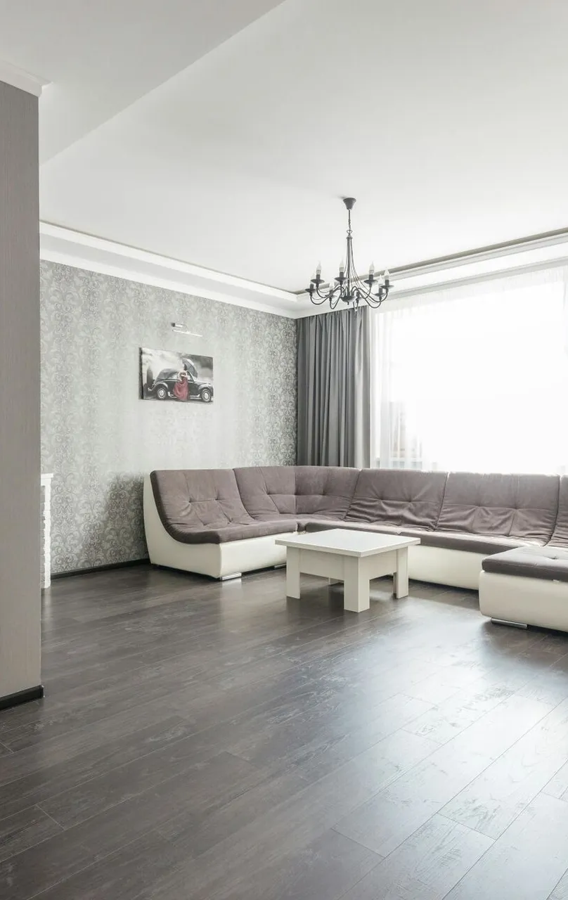 View of empty spacious living room with wooden