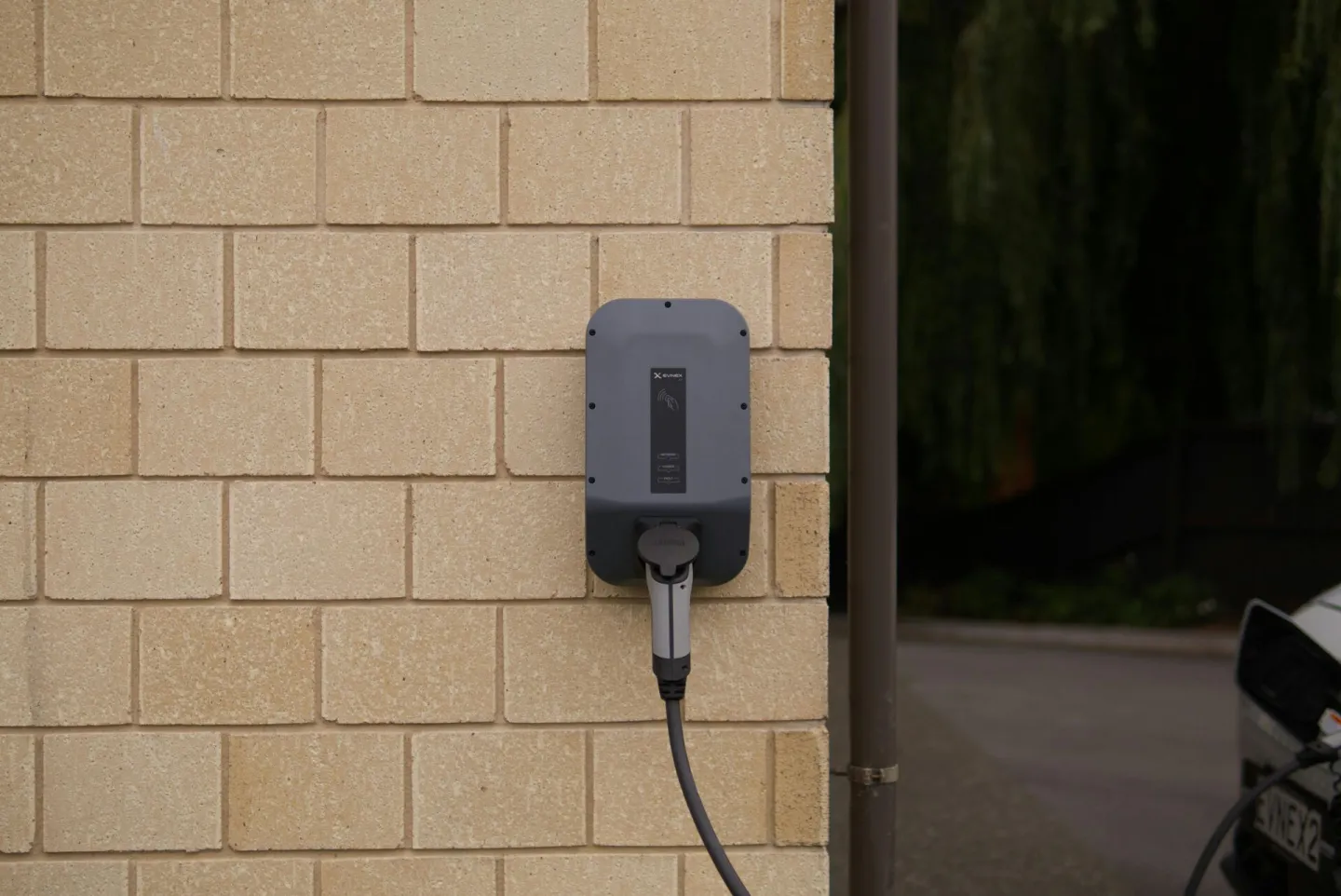 A wall-mounted electric vehicle charging station