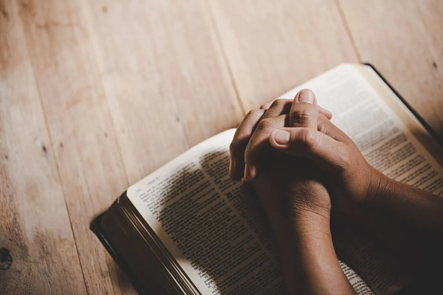 Spirituality and religion, Hands folded in prayer on a Holy 