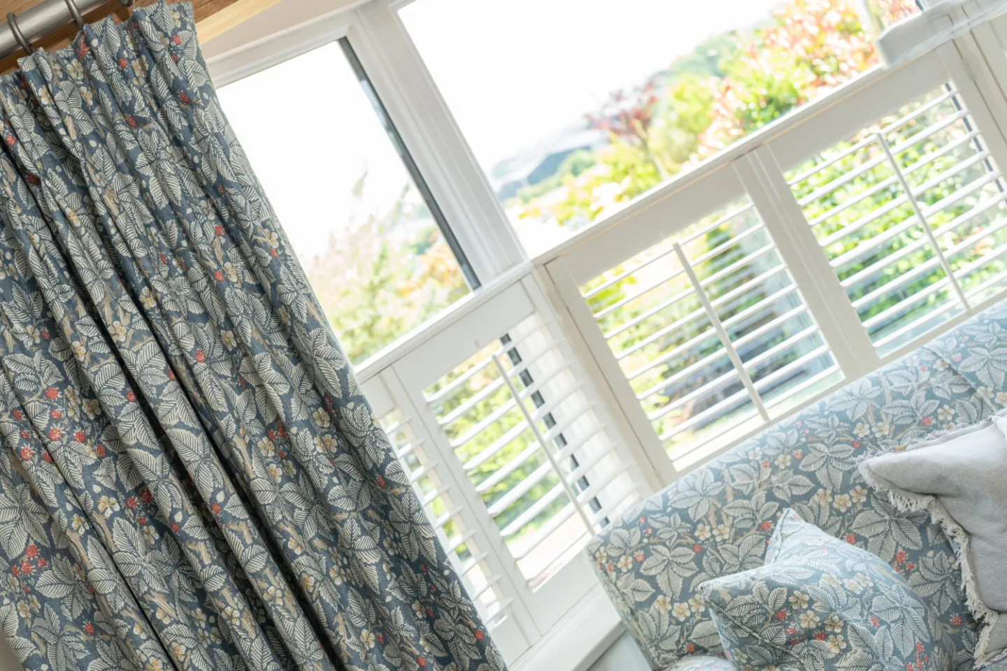 Shutter blinds with grey curtains