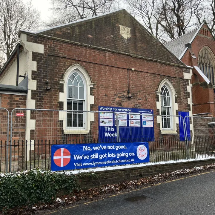 Building With Fencing and Banner