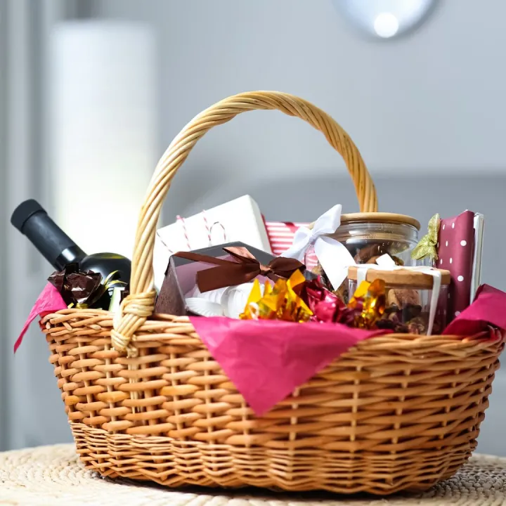 A wicker welcome hamper filled with local produce, wine and preserves
