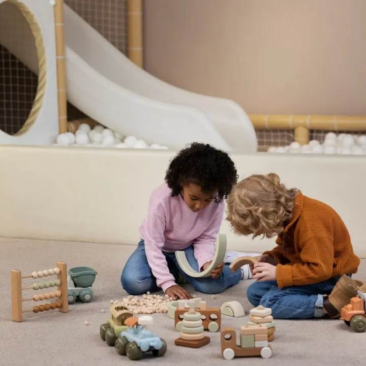 Full shot kids playing with eco toys indoors