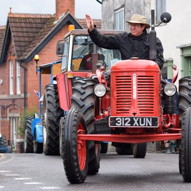 Tractor Owner Waves to The Crowds