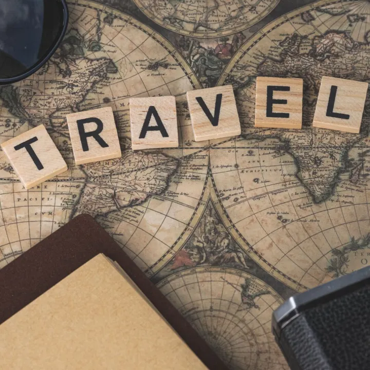Vintage map with travel essentials like camera