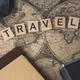 Vintage map with travel essentials like camera