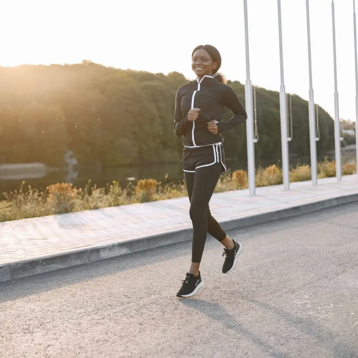 Runner training outdoors in morning light