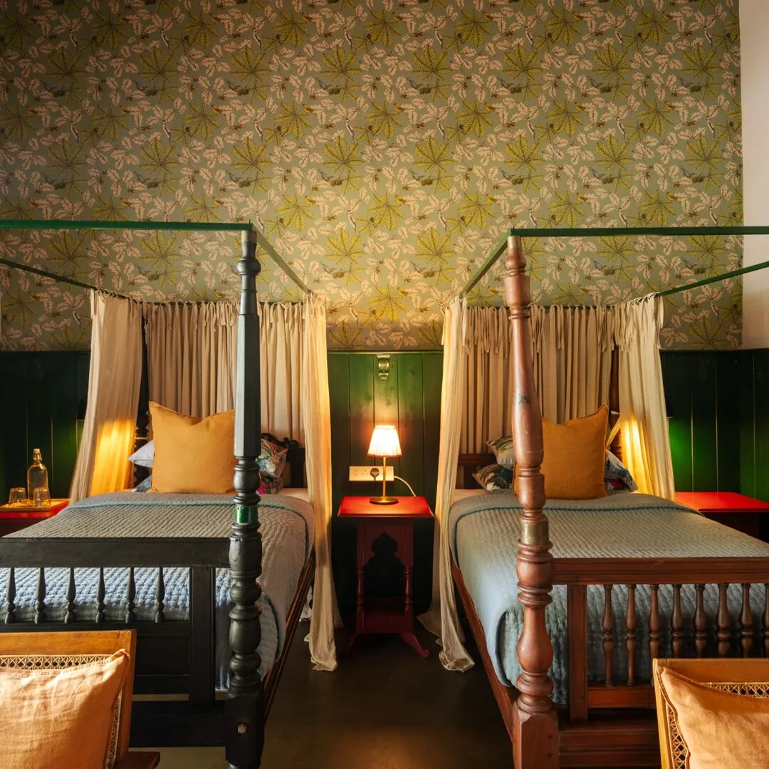 Two antique four poster beds in the Lake View Suite at Peacock Hill Sigiriya