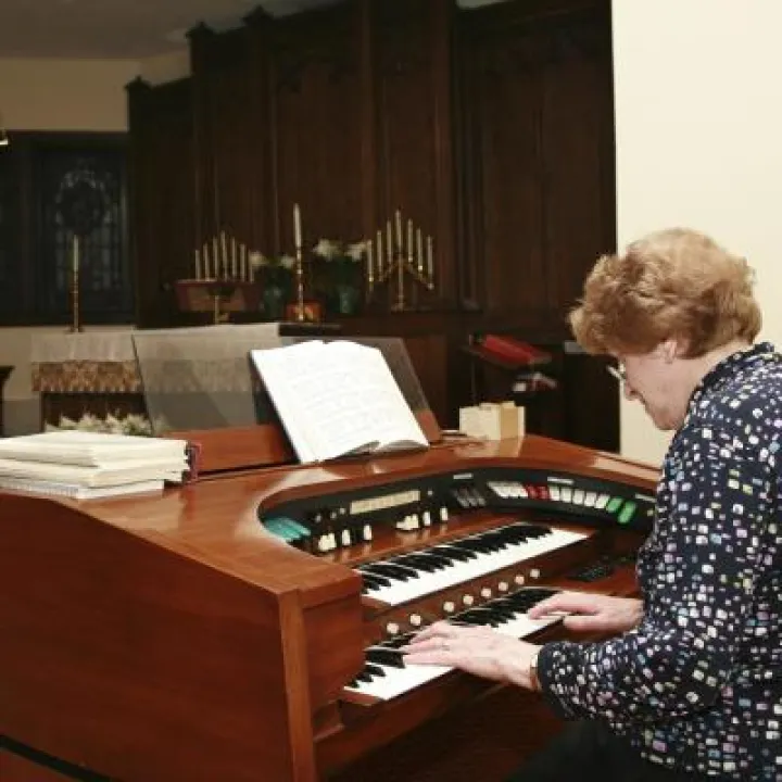 woman playing organ