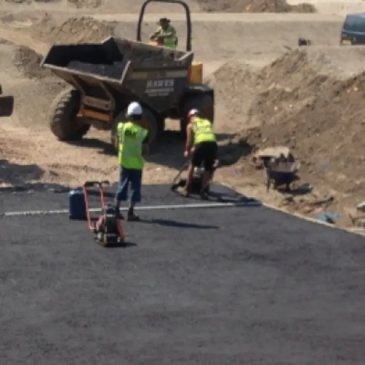 Tarmac laying and surfacing
