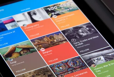 Close-up of a tablet displaying diverse content collections in a grid format.