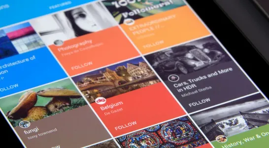 Close-up of a tablet displaying diverse content collections in a grid format.