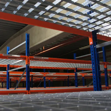 Newly painted warehouse shelving with blue columns and red beams