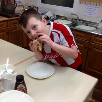 Arthur eating pancakes