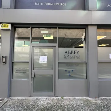 Glass doorway at Abbey College Manchester.